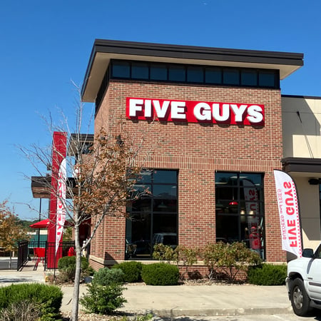 Exterior photograph of the Five Guys restaurant at 9133 Metcalf Avenue in Overland Park, Kansas.