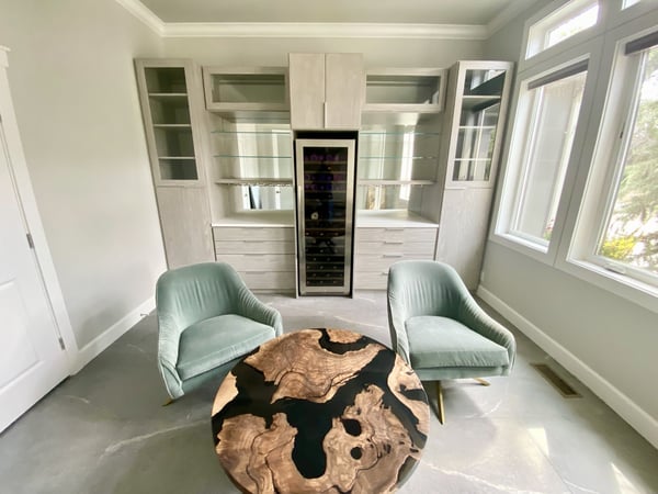 Bar with built in wine refrigerator and glass shelves