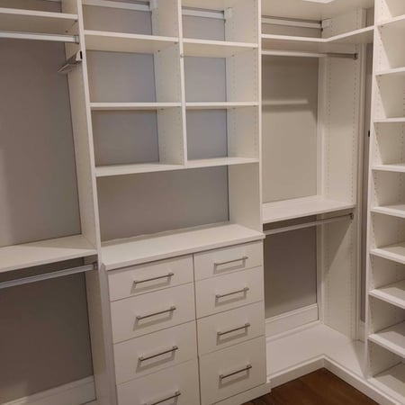 White closet with floor-to-ceiling shelves