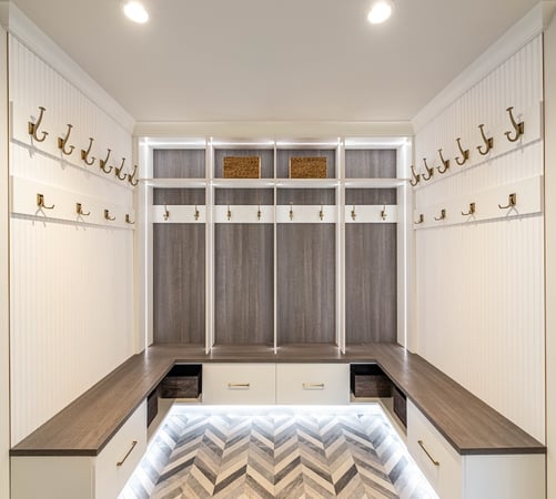 herringbone flooring, mudroom, custom mudroom, family mudroom, grey wood, grey back paneling, grey and white wood, gold hardware, gold hooks, mudroom lighting, canton, Michigan