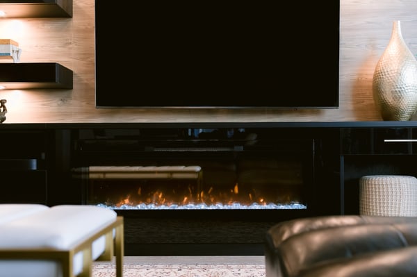 Closer look at the electric fireplace built into the base of a media centre.