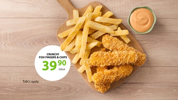 Fish and chips takeaway meal for kids with panko crumbed fish fingers and chips against a wood background.