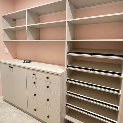 Virginia Beach - Custom closets - Custom closet system with soft blush walls, open shelving, and drawers.