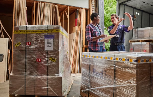 A group of people in a warehouse