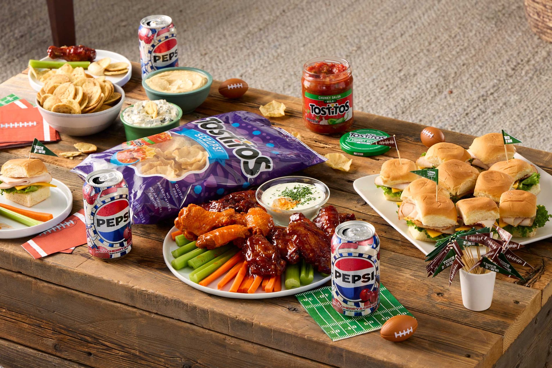 tailgate party food and appetizers on a table