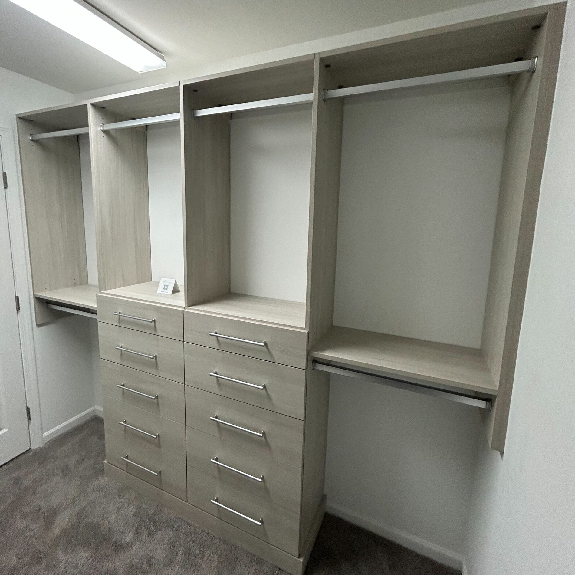 closet system with drawers and hanging space