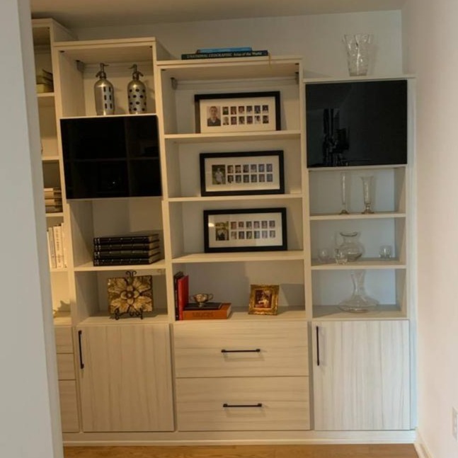 A living room shelving unit designed for display and functionality.