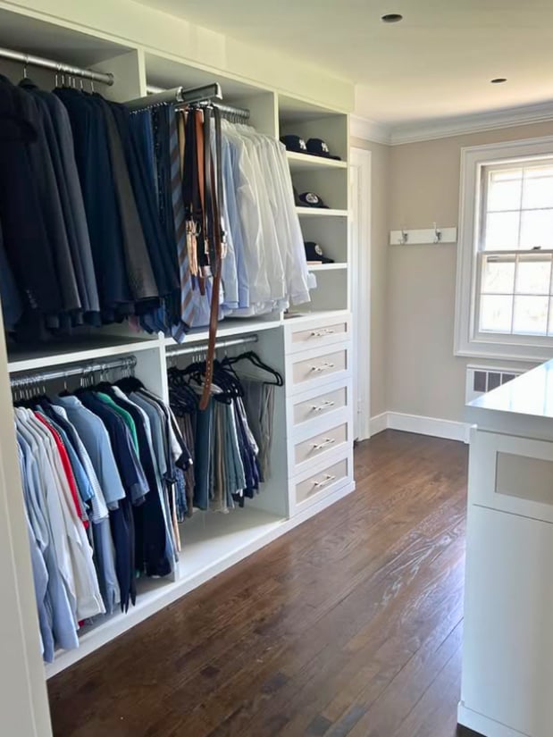 Floor-to-ceiling walk-in primary closet