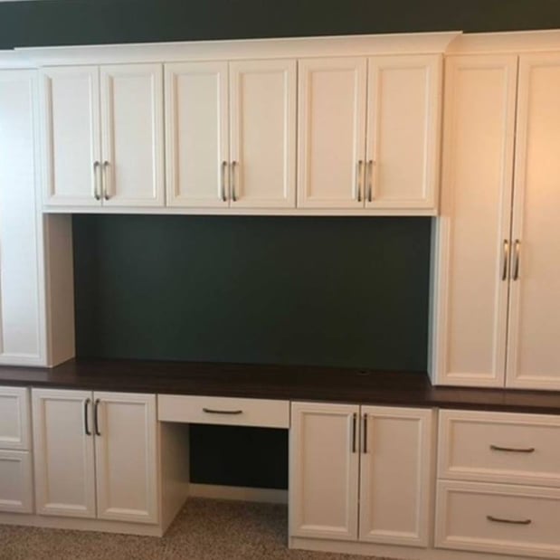 Richmond - Custom closets - Home office desk with cabinets and drawers with a cutout in the center for a computer setup