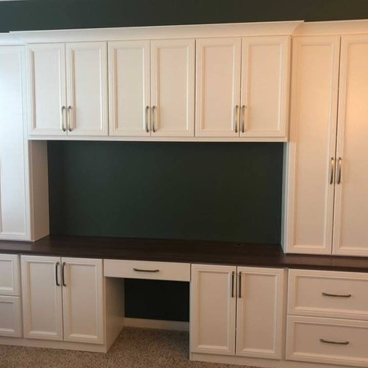 Richmond - Custom closets - Home office desk with cabinets and drawers with a cutout in the center for a computer setup