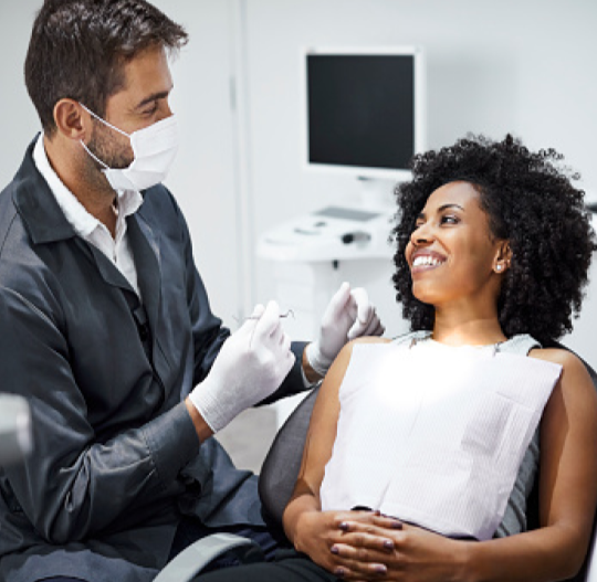 smiling patient being consulted by dentist