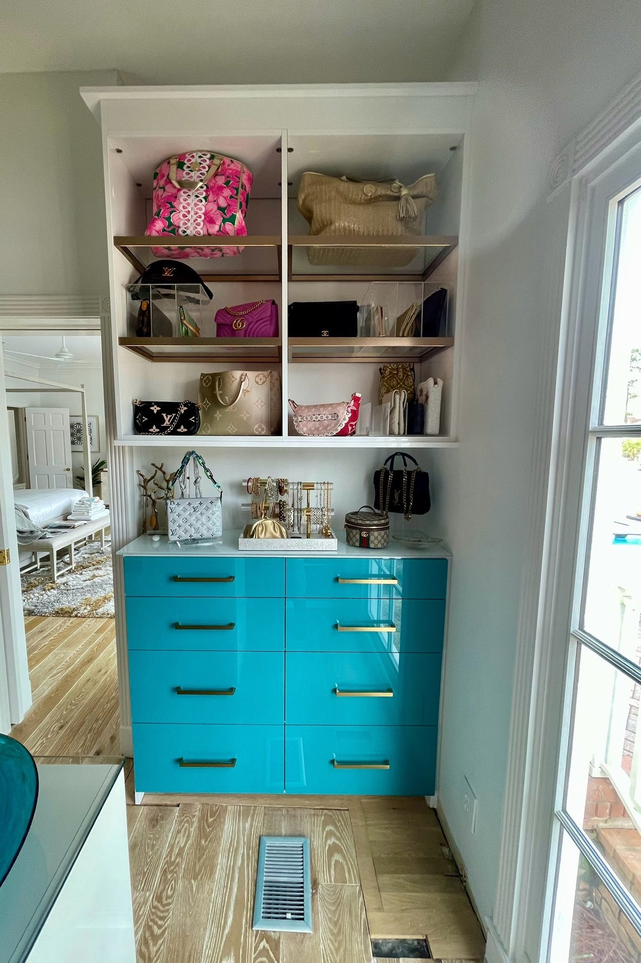 Glossy blue closet system with glass shelves Pensacola & Panama City, Florida
