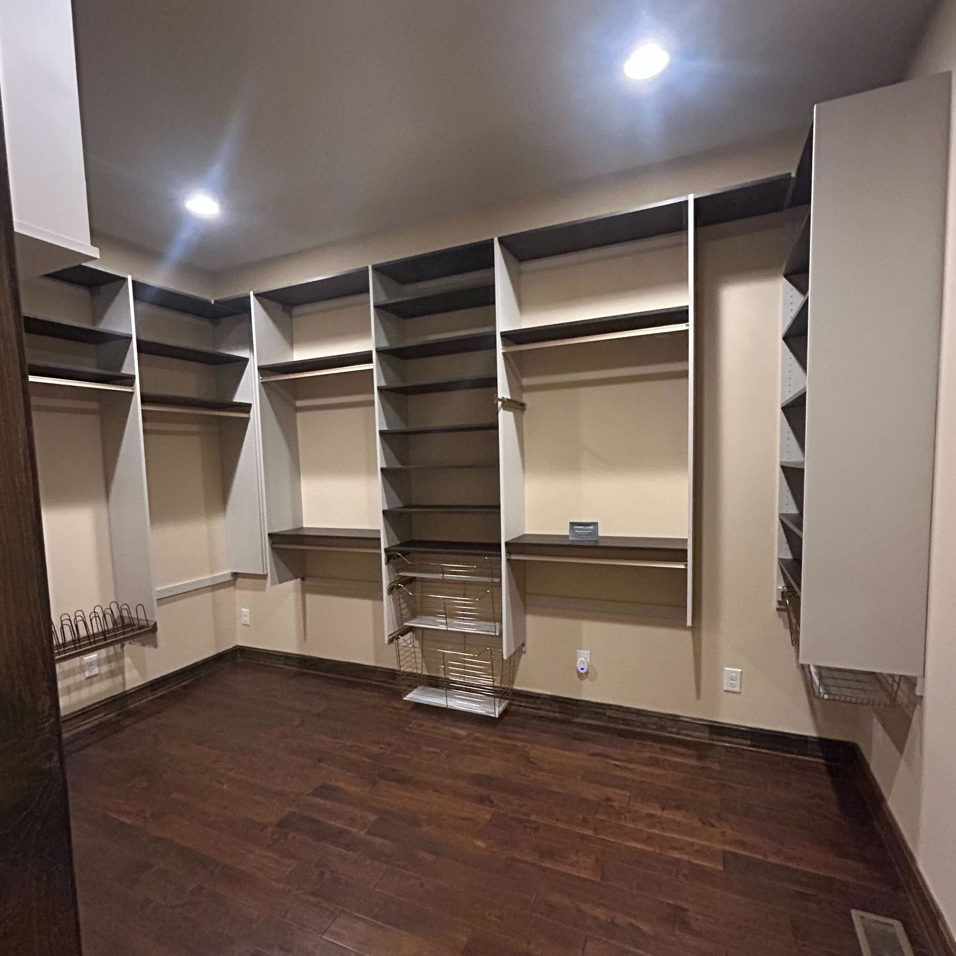 Greensboro - Custom closets - Walk-in closet with plenty of racks for hanging clothing and shelves for storage