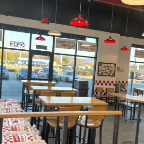 Image of the dining room of the Five Guys restaurant at 1221-A N. Memorial Pkwy in Huntsville, Alabama.