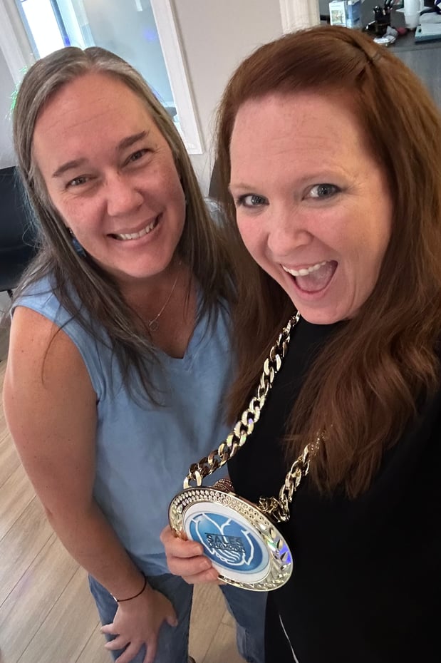 July was a BIG month!. Angie is showing off her back to back Sales Champion award, and Kristi set a new personal high!  Great job by the entire team!