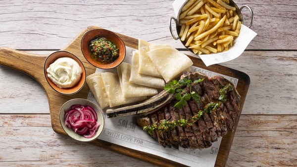 Mexican Prime Rib from Salsa Mexican Grill Loftus Park with 600 grams of prime rib, tortillas, sour crema, pickled red onion, chimichurri and shoestring fries.