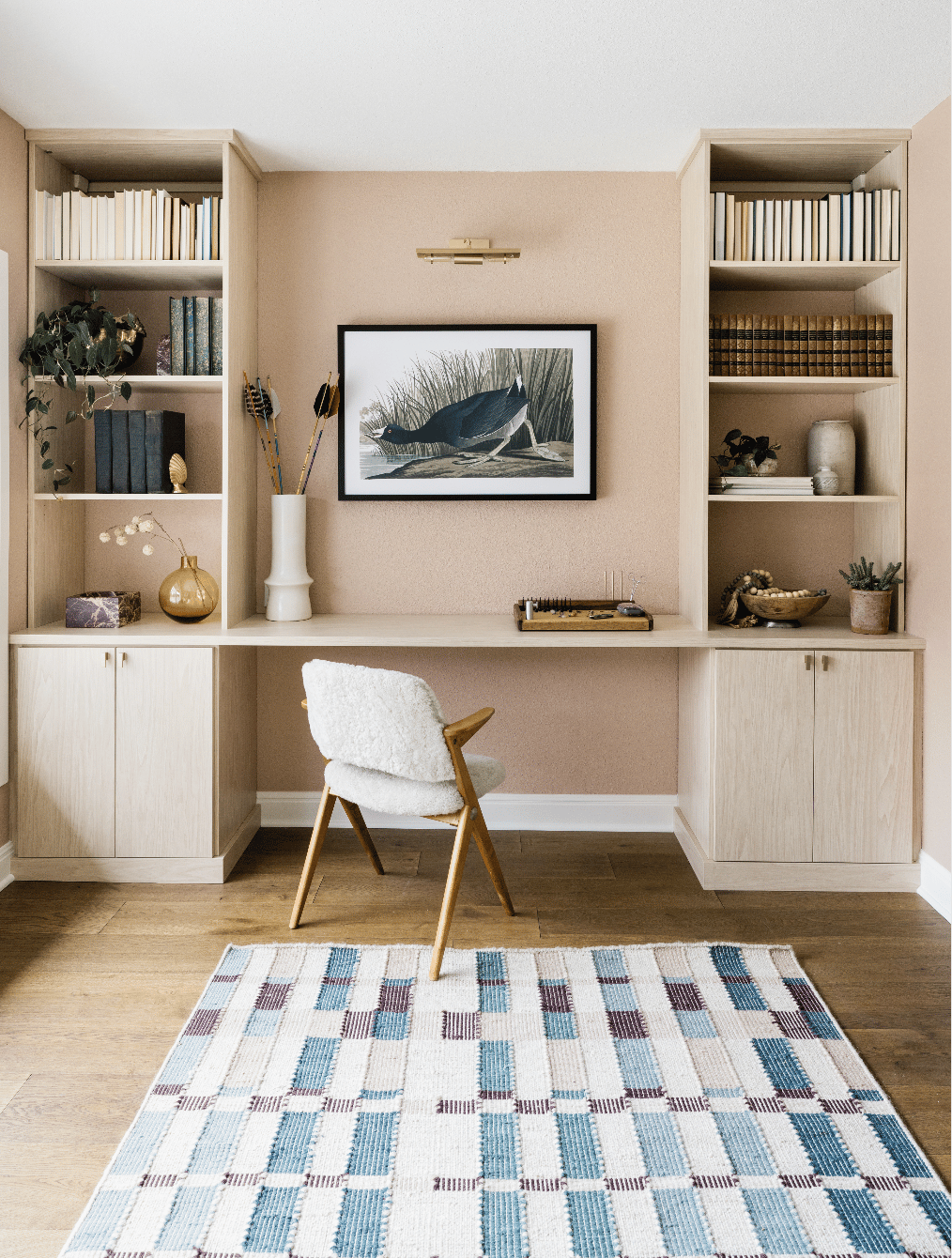 California Closets Austin custom home office setup, featuring floor-to-ceiling storage with adjustable shelving, and ample file drawers for a personalized, organized workspace with a serene neutral palette.