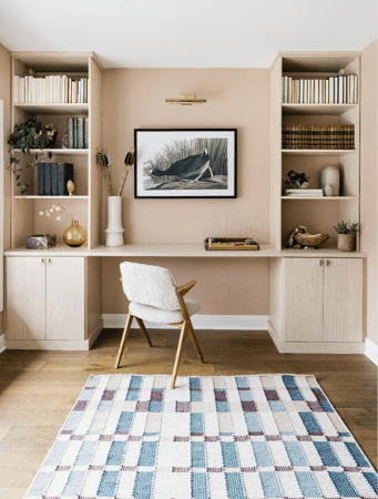 California Closets Austin custom home office setup, featuring floor-to-ceiling storage with adjustable shelving, and ample file drawers for a personalized, organized workspace with a serene neutral palette.