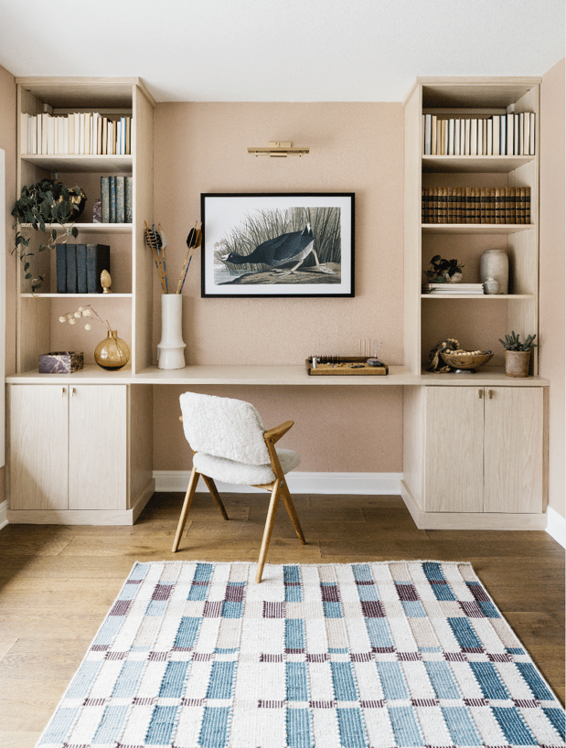 California Closets Austin custom home office setup, featuring floor-to-ceiling storage with adjustable shelving, and ample file drawers for a personalized, organized workspace with a serene neutral palette.