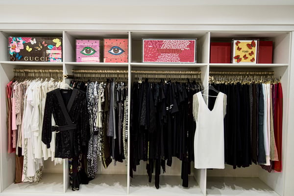 White closet organization with gold hanging poles California Closets New Orleans & Gulf Coast