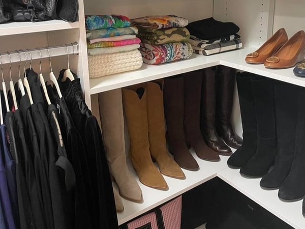 Greensboro - Custom closets - wrap-around corner shelving with organized shoes and clothing
