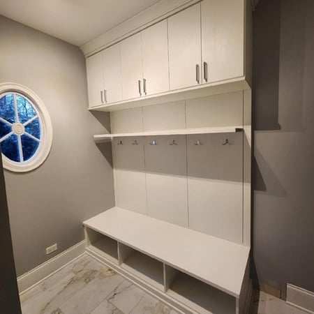 Built-in wardrobe for entryway with shoe storage, hooks, shelves, and doors