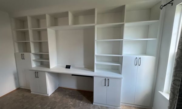Virginia Beach - Custom closets - Wall-to-wall built-in desk and shelving unit in white finish.