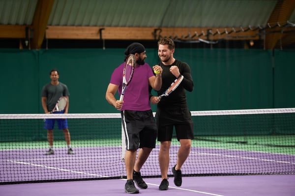 Men on tennis court