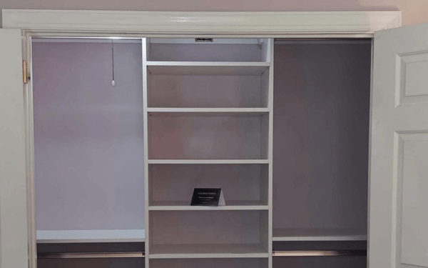 White reach-in closet storage.