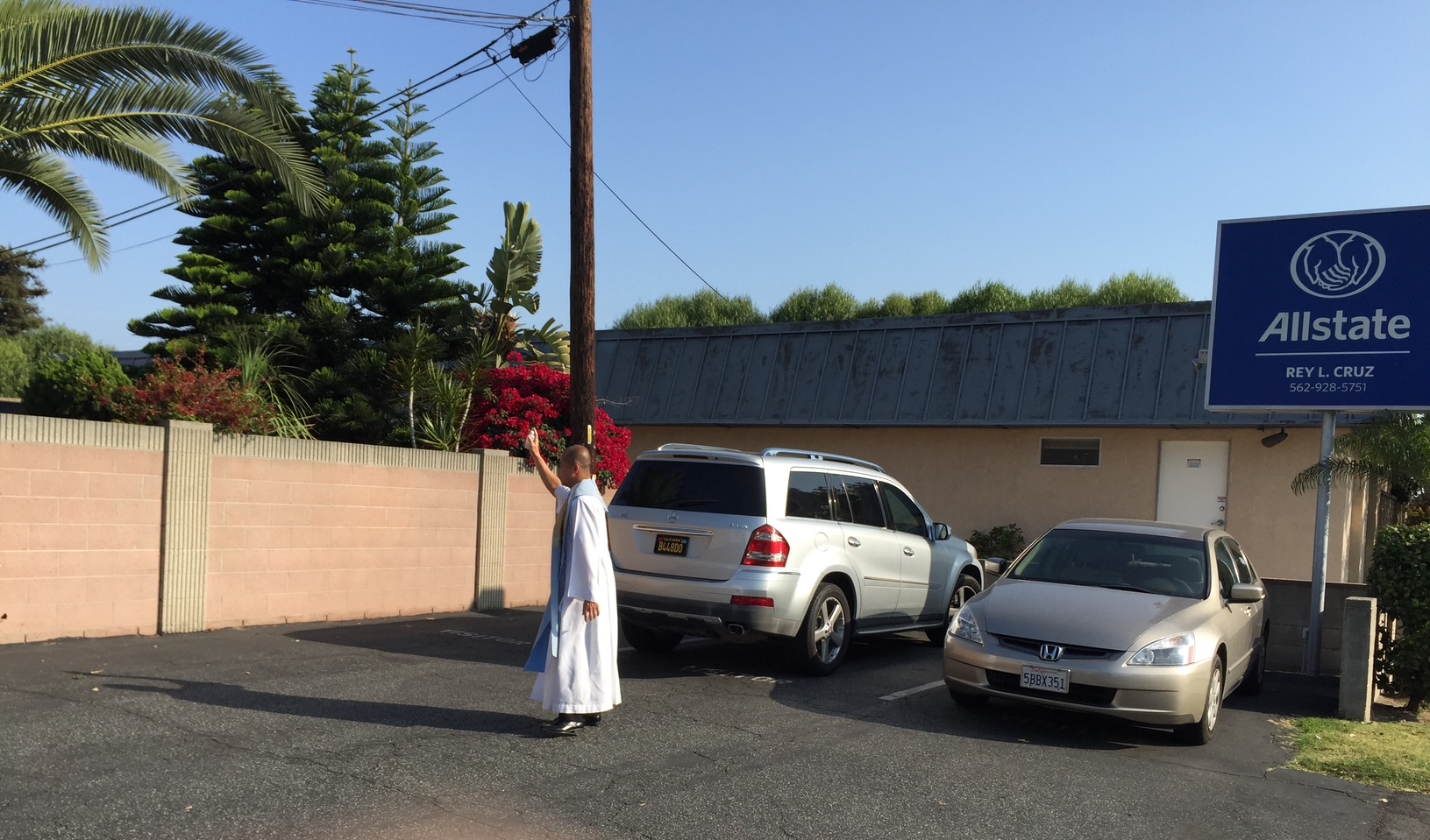 Father Blessing The Parking Lot