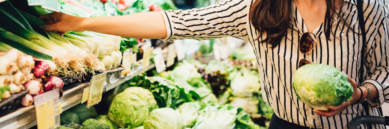 woman choosing fresh and healthy food from [c_groceryBrand]