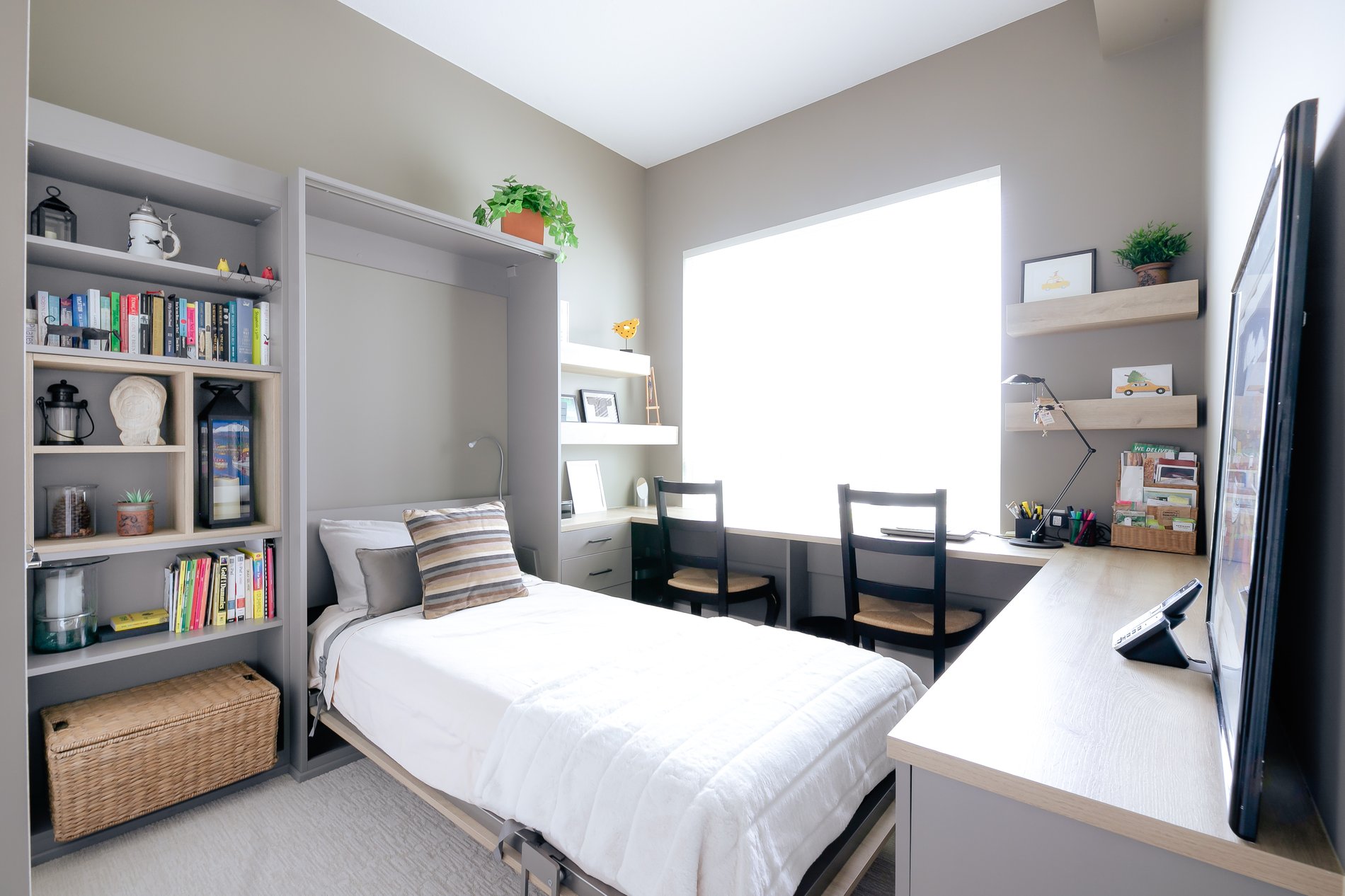 Full view of a custom built home office with a wall bed