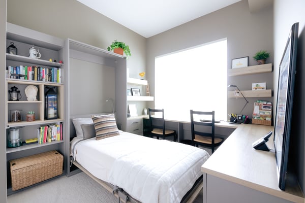 Full view of a custom built home office with a wall bed