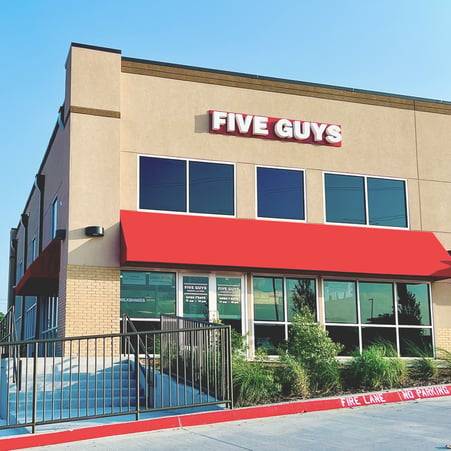 Exterior photograph of the Five Guys restaurant at 4724 Lakeview Parkway in Rowlett, Texas.