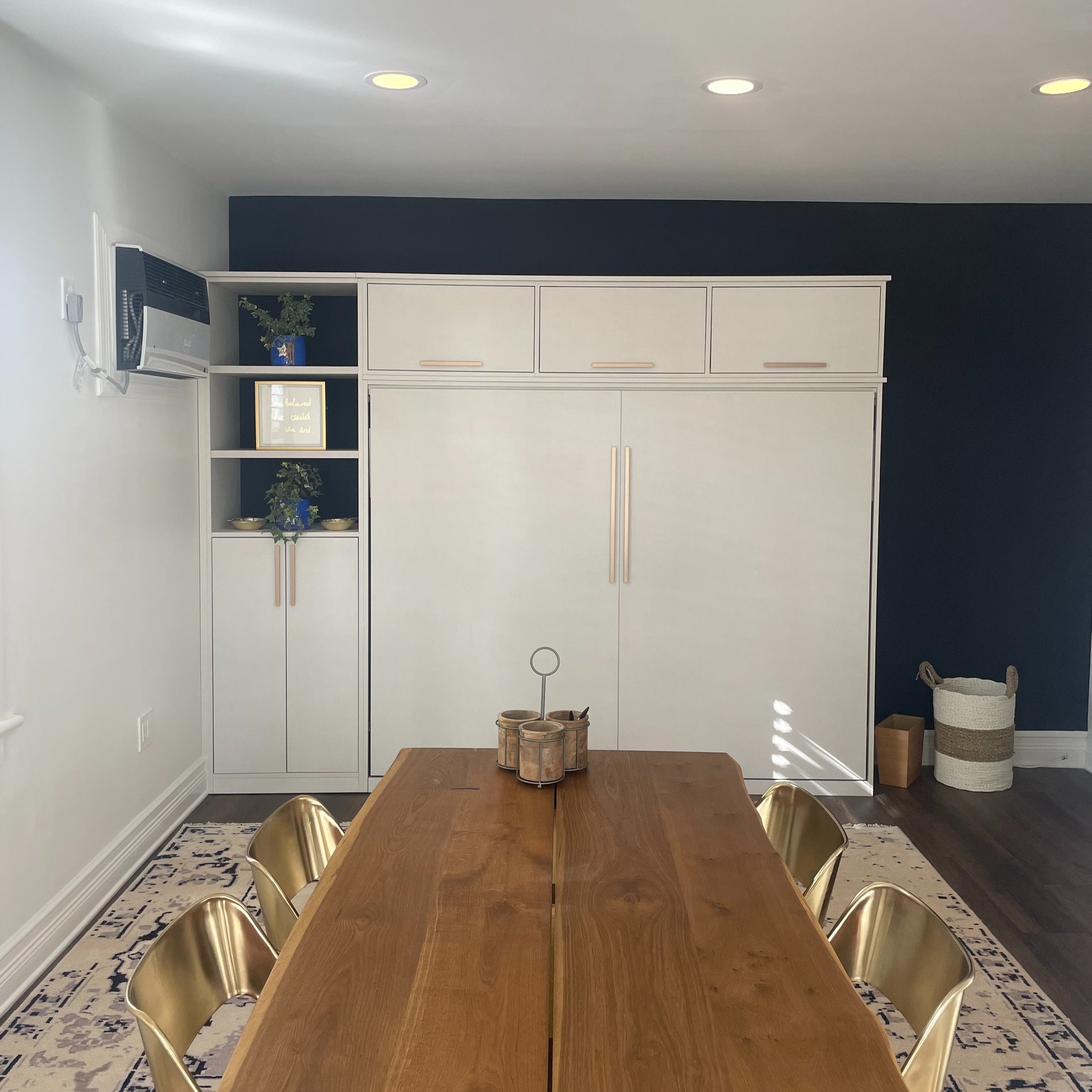 A hidden wall bed seamlessly integrated in a soft linen finish.