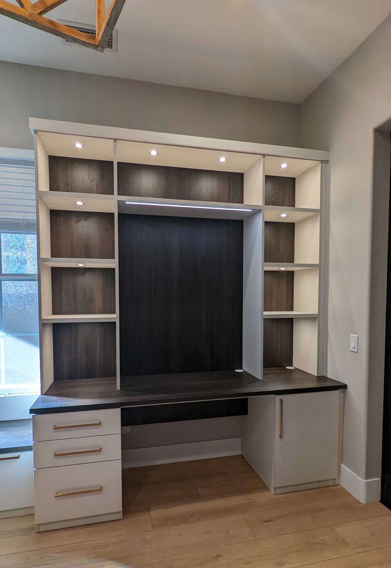 Modern home office with opening for wall art display.