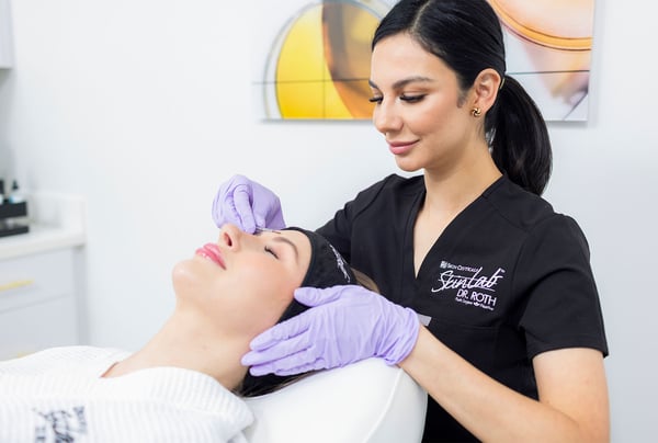 Patient receiving a treatment from a provider at SkinLab Houston.