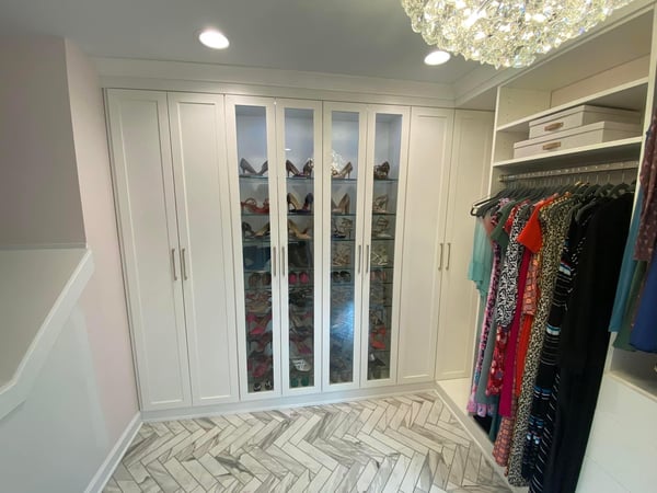 Long hanging in white with a windowed door that leads to a lovely shoe rack.