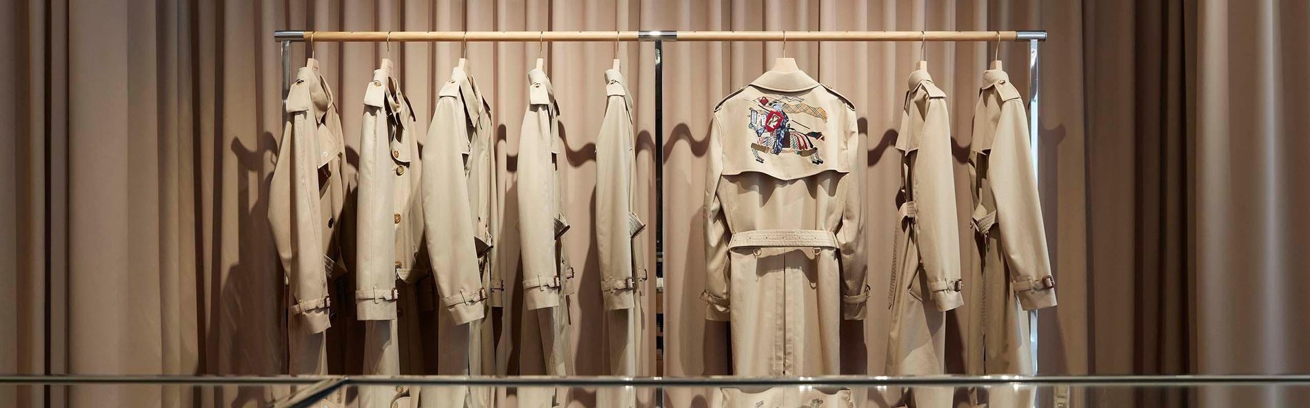 Close up of Burberry trench coat display.
