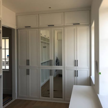 Richmond - Custom closets - White walk-in closet with cabinets and mirrors