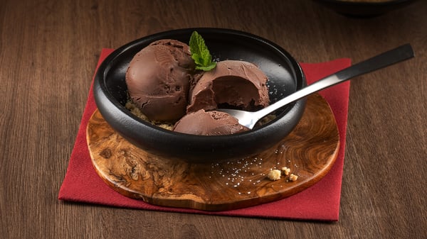 Two desserts from Turn ‘n Tender Waterfall Wilds: a bowl of cherry cheesecake gelato and a bowl of double toffee gelato.