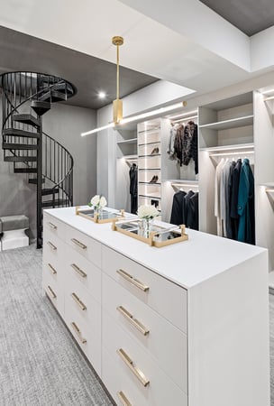 Custom Built walk in closet with lighting under the cabinets and island by California Closets Greater Detroit, Michigan.