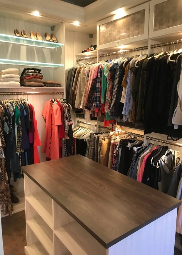 Greensboro - Custom closets - Beautiful walk-in closet with organized clothing, a center island, storage shelves, and LED lights