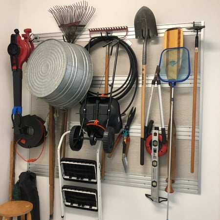 Fusion track wall storage in garage California Closets New Orleans & Gulf Coast