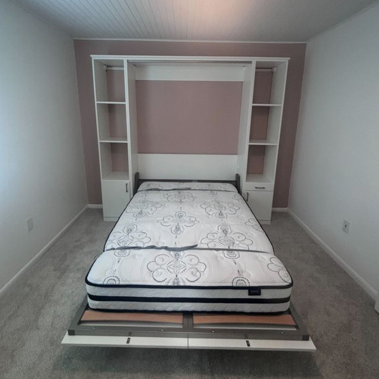 Virginia Beach - Custom closets - Wall bed cabinet system open, revealing a queen-sized mattress.
