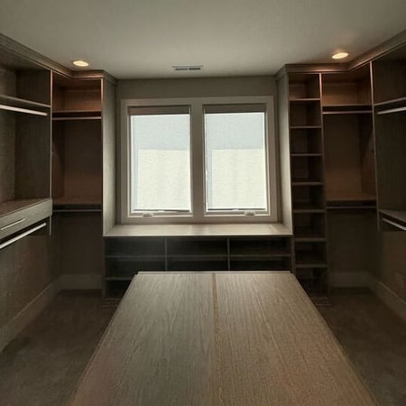 Wilmington - Custom closets - Walk-in closet with wood grain finish, recessed lighting, and natural light from windows.