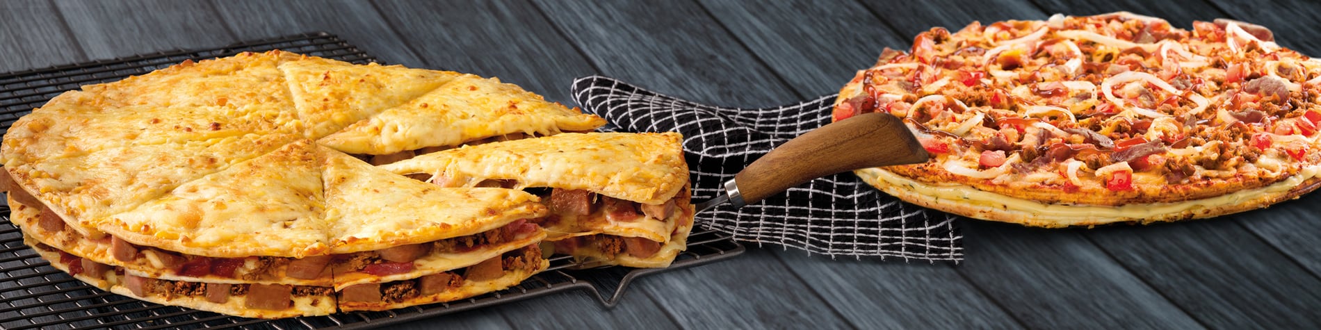 Speciality pizzas from Debonairs Pizza, including the Triple-Decker® – 3 layers of pizza stacked with meat between the layers with a cheese topping