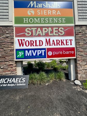 MVPT - Bedford outside signage in the plaza with Staples, World Market and Marshals in New Hampshire.