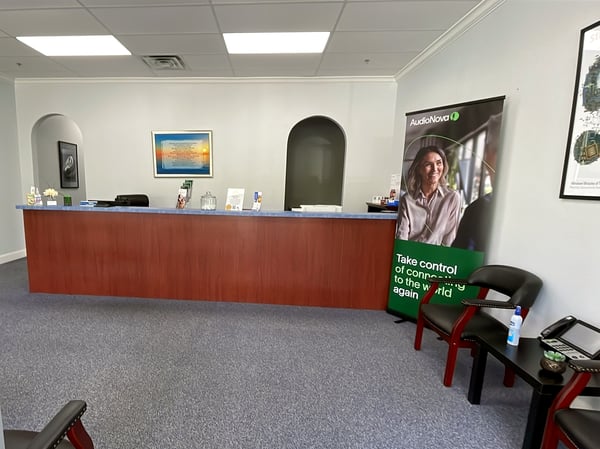 Interior photo of the reception desk for AudioNova hearing clinic in Port St. Lucie, FL