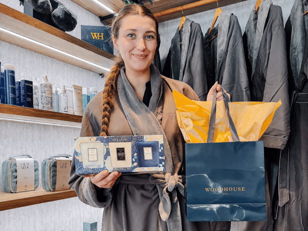 Woodhouse Spa SouthPark gift card promotion with a cozy robe and Voluspa candles for Mother’s Day